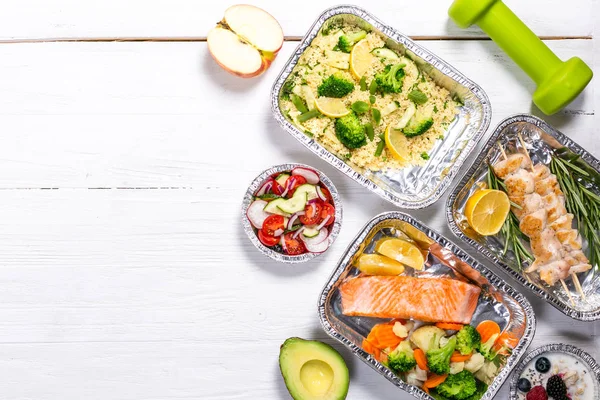 Healthy food delivery concept - meals in fossil containers