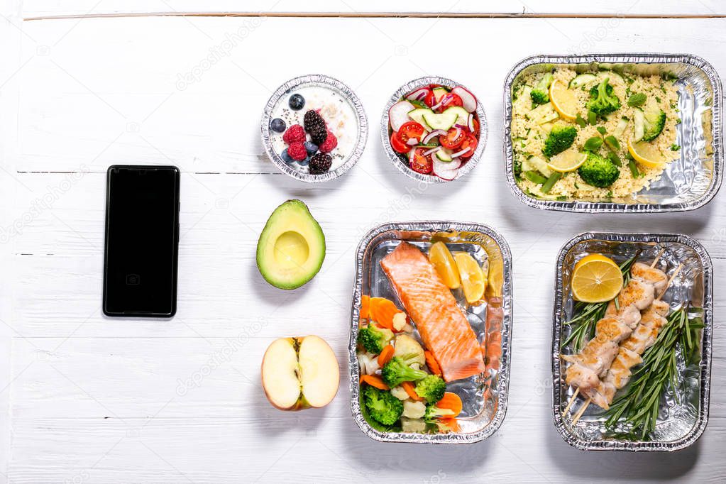 Healthy food delivery concept - meals in fossil containers