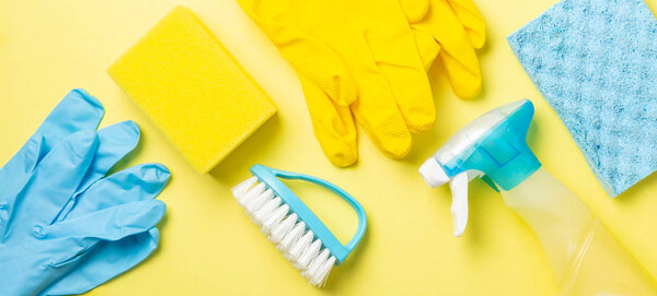 Cleaning concept - blue and yellow cleaning supplies