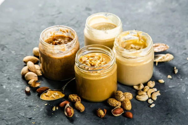 Selection of nut butters - peanut, cashew, almond and sesame seeds