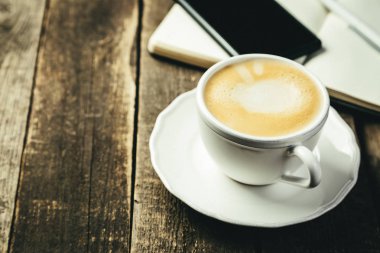 İş sabah kavramı - kahve, not defteri, telefon