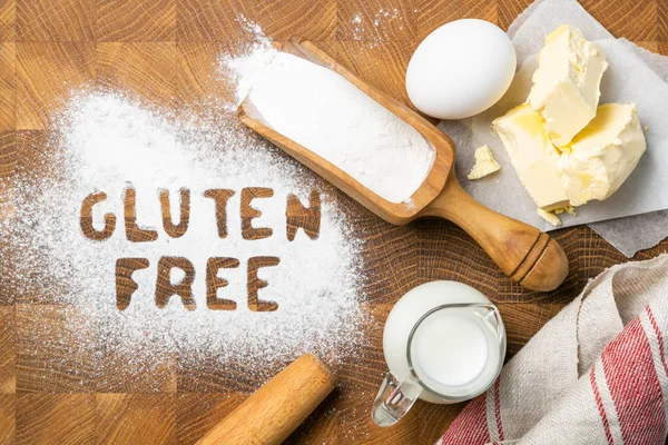 Gluten free baking concept - text with kitchen utencils, eggs, milk, butter — Stock Photo, Image