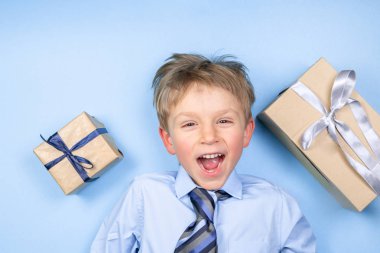 Fathers day concept - boy wears formal shirt and tie just blue background clipart