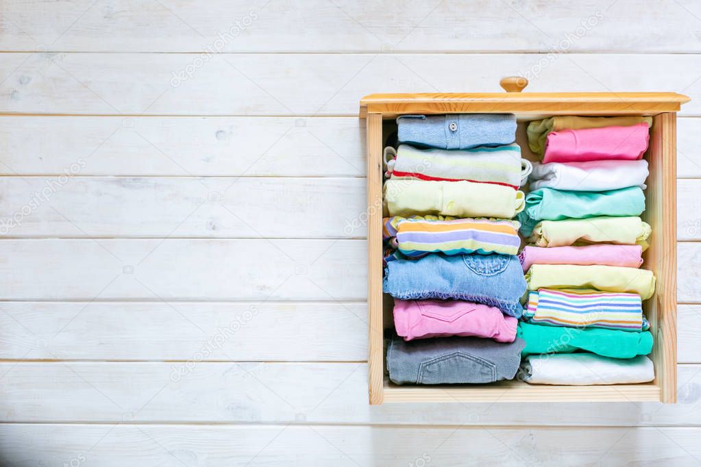 Marie Kondo tyding up method concept - folded clothes