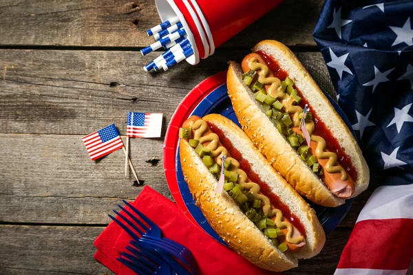 USA national holiday Labor Day, Memorial Day, Flag Day, 4th of July - hot dogs with ketchup and mustard on wood background