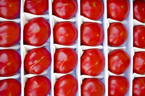 red tomatoes in a box