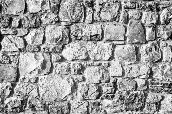 Fondo de la antigua pared de ladrillo de piedra . — Foto de Stock