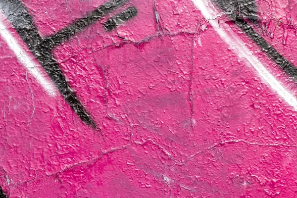 Fragment of colored graffiti painted on a wall.