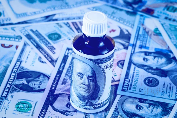 Bottle of drug or vitamin with dollars. Medical or pharmacy prescription for health. Concept of cost of the healthy life.