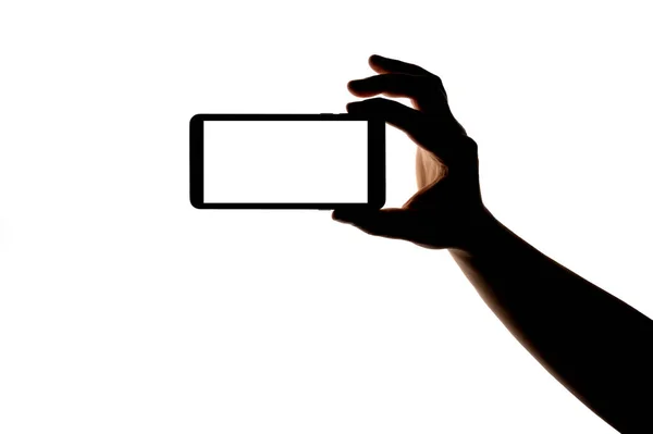 Silhouette Mano Con Smartphone Scattare Foto Isolate Sfondo Bianco Schermo — Foto Stock
