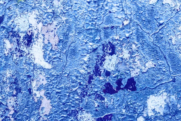Fragment of colored graffiti painted on a concrete wall. Texture. Abstract background for design. Peeling color paint.