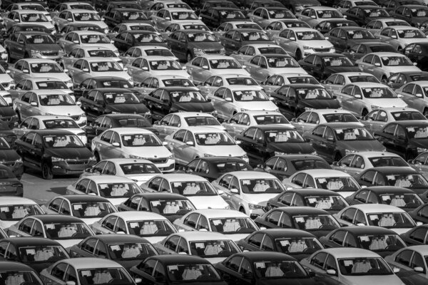 Volkswagen Group Rus, Russia, Kaluga - MAY 24, 2020: Rows of a new cars parked in a distribution center on a day in the spring, a car factory. Parking in the open air. Black and white photography.