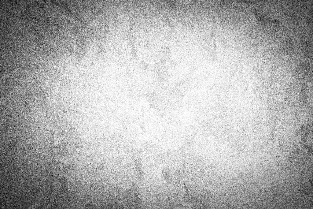 Gray decorative plaster texture with vignette. Abstract grunge background with copy space for design.