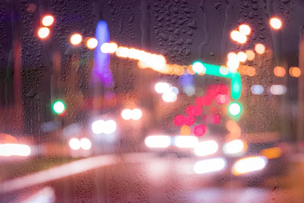 Defocused Headlights Moving Cars Rainy Wet Glass Night Abstract Concept — Stock Photo, Image