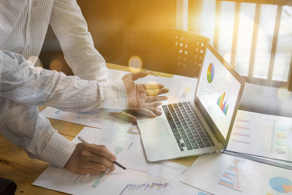 Teamwork concept, man and woman operate in office with laptop