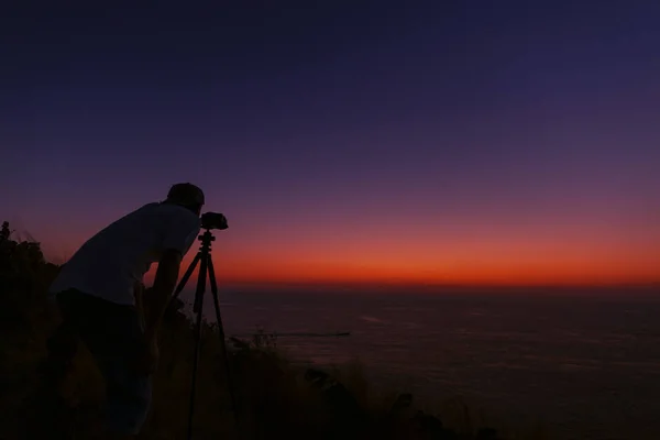 Professional photography man take a photo sunset or sunrise — Stock Photo, Image