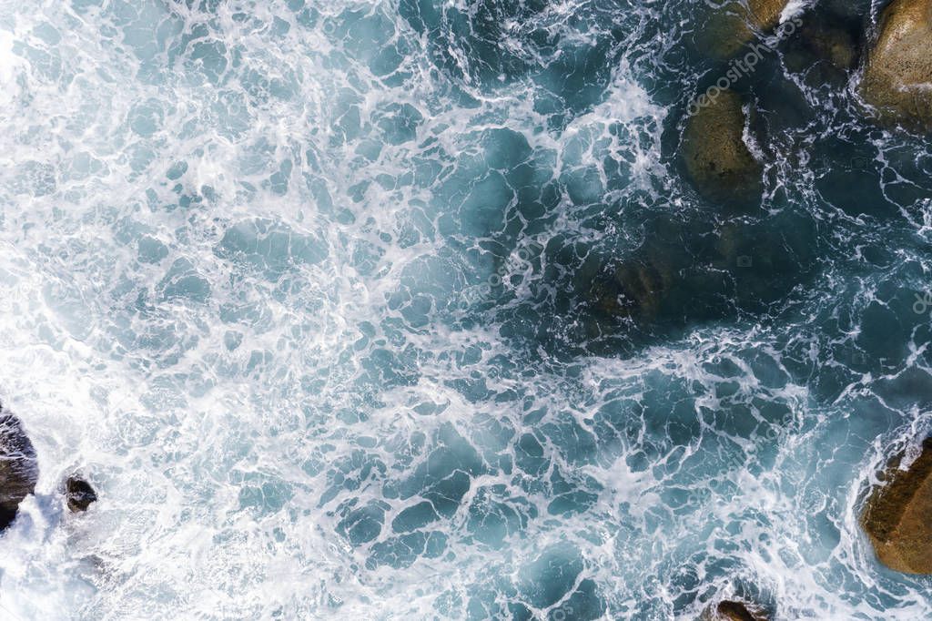 Aerial view of crashing waves on rocks landscape nature view 