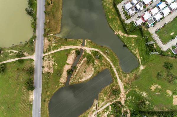 Aerial view drone Top view shot of asphalt road and lake — Stock Photo, Image