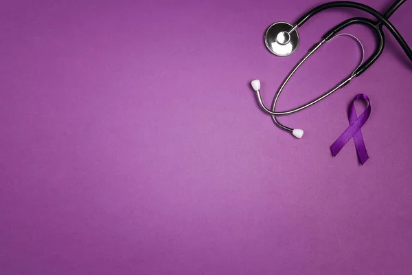 Purple epilepsy awareness ribbon with stethoscope and copy space