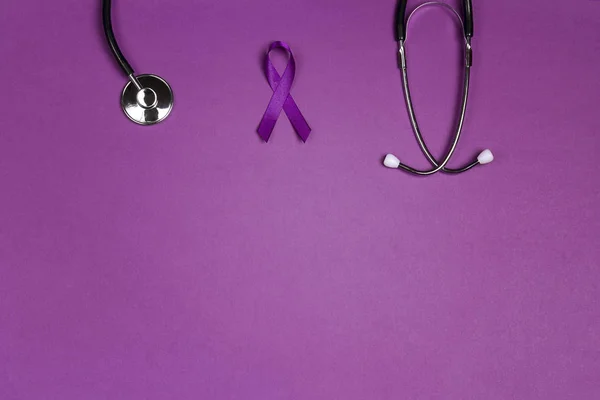 Purple epilepsy awareness ribbon with stethoscope and copy space