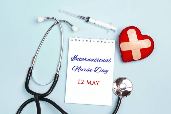 International Nurse Day message on notepad with stethoscope and