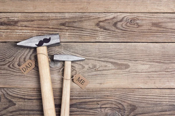 Fathers day background with dad-  hammer and son -  hammer. — Stock Photo, Image