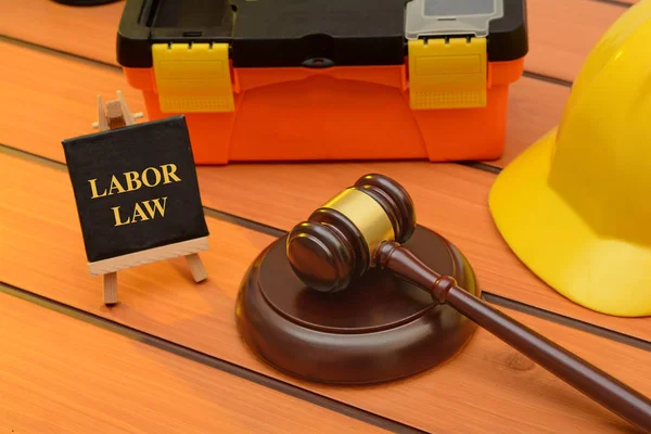 Labor law theme with wooden gavel on table, legislation concept