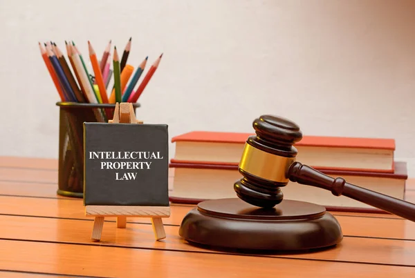 Intellectual property law conceptual photo with books in background