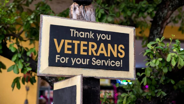 Thank you Veterans written on a Wooden Sign Board