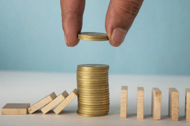 Financial support business concept with Coin Stack and wooden blocks