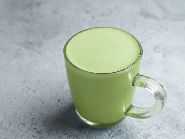 Matcha green tea latte in glass cup