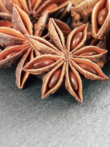 star anise on gray slate background close up with copy space