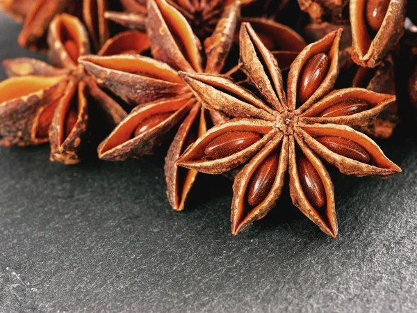 star anise on gray slate background close up with copy space