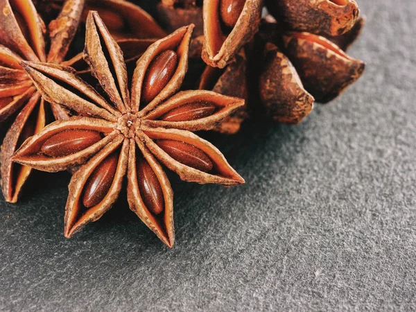 star anise on gray slate background close up with copy space