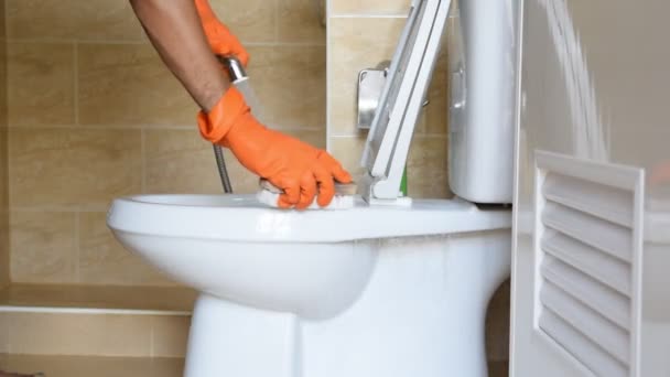 Hand Man Wearing Orange Rubber Gloves Used Convert Polishing Toilet — Stock Video