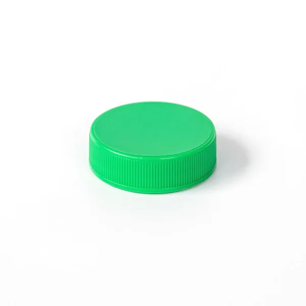 Grön plastflaska mössa — Stockfoto