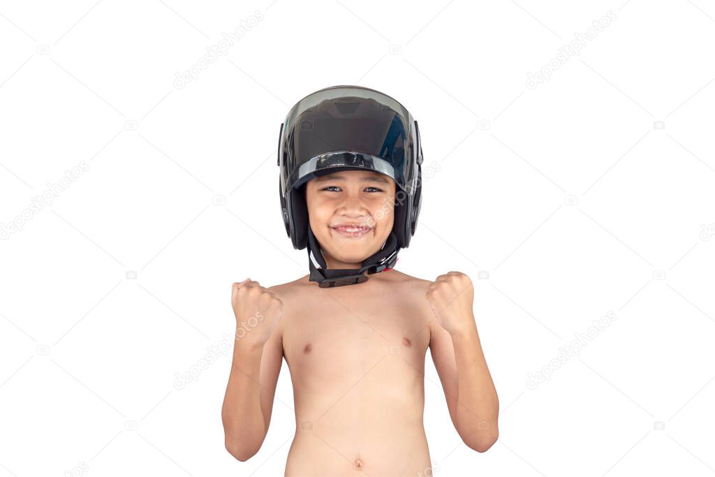 A boy wearing a motorcycle helmet stands smiling but without a shirt isolated on white background.
