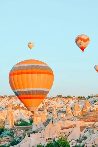 Orange hot air balloons in the sky above Cappadocia. Goreme.