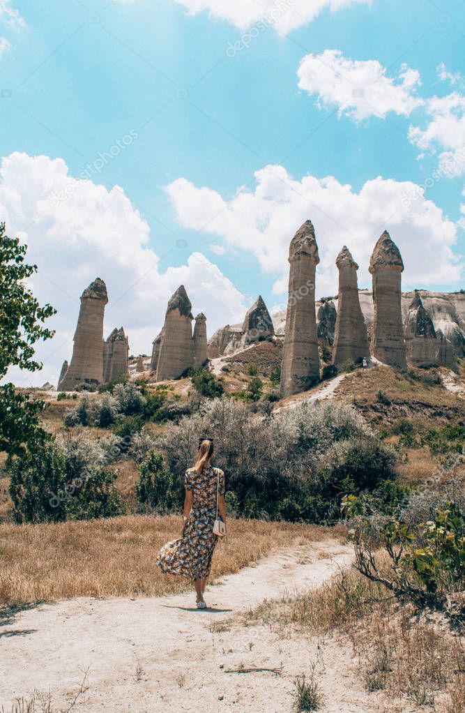 Cappadocia. Young woman walking in Love valley. Goreme.