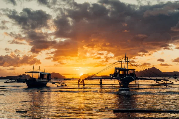 Philippines. Local boat\'s silhouette at the bay. Sunset sky. El Nido.