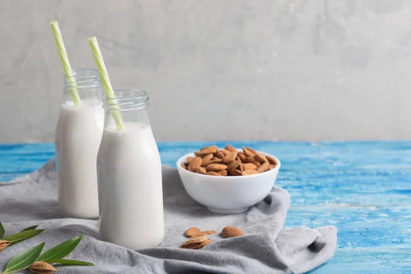 Almond milk on a blue wooden table — Stock Photo, Image