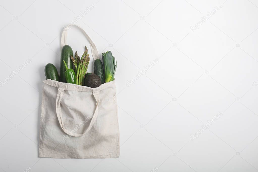 Reusable zero waste textile product bag, top view on white background with copy space