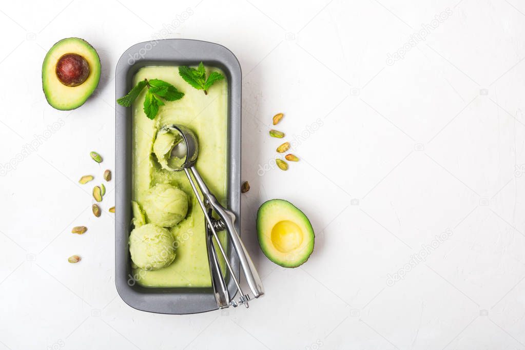 Homemade organic avocado and mint ice cream in a metallic container