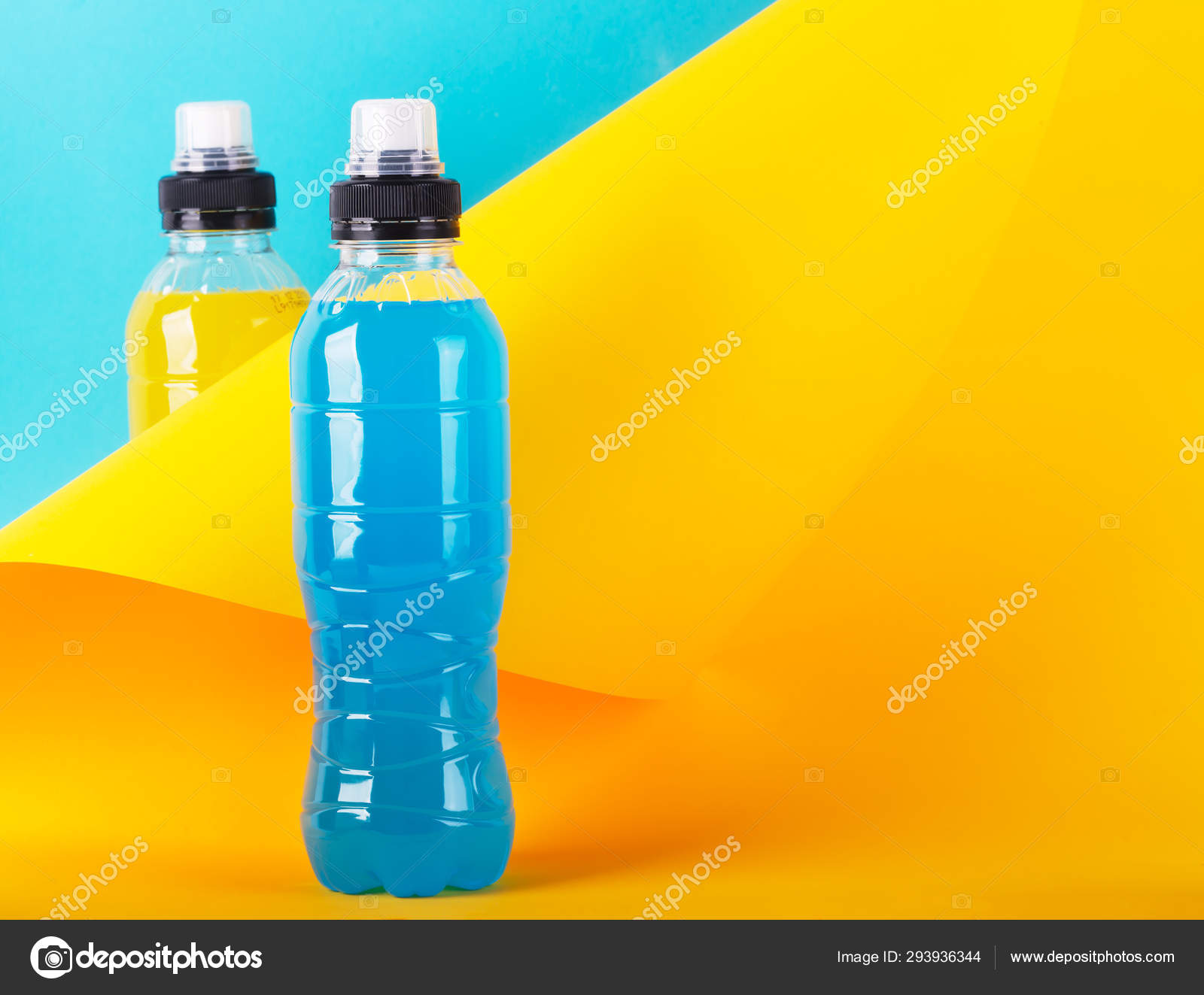Isotonic Energy Drink Bottles With Blue And Yellow Transparent Liquid Sport Beverage On A Colorful Background Stock Photo By C Civil