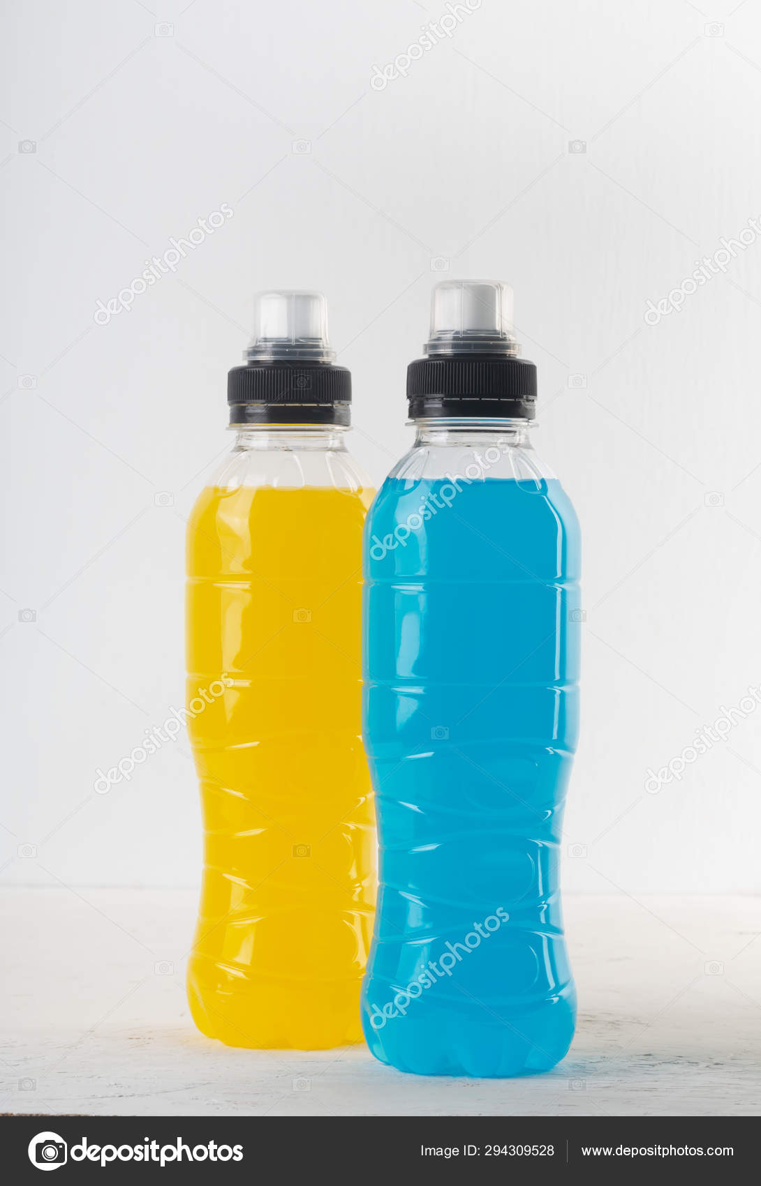 Isotonic Energy Drink Bottles With Blue And Yellow Transparent Liquid Sport Beverage On A White Background Stock Photo By C Civil