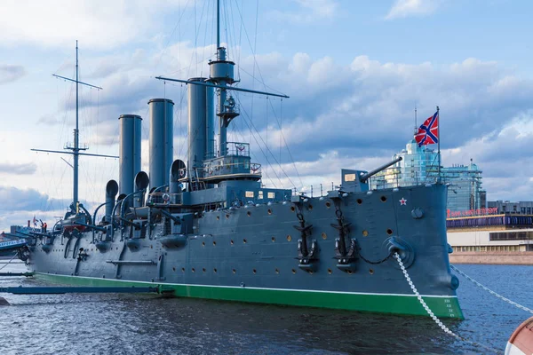 Petersburg, Russia - May 4 2019:Russian cruiser Aurora in the mouth of Neva river in Petersburg near Nakhimov Naval School in the evening. The navy museum and the symbol of Great October revolution