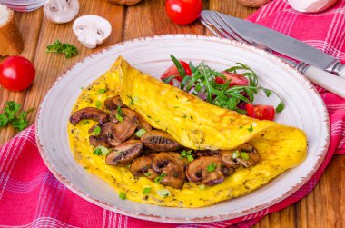 Kızarmış yağlı mantar ve otlar ile omlet