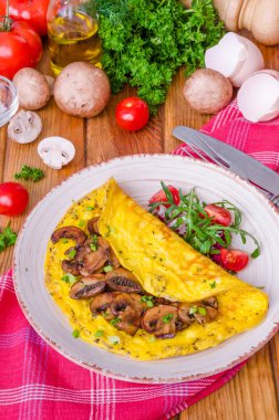 Kızarmış yağlı mantar ve otlar ile omlet