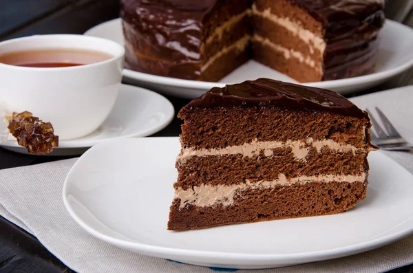 Chocolate layer cake with butter cream. Traditional cake Prague.