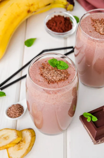 Chocolate banana milkshake (smoothie). Summer cold drink.